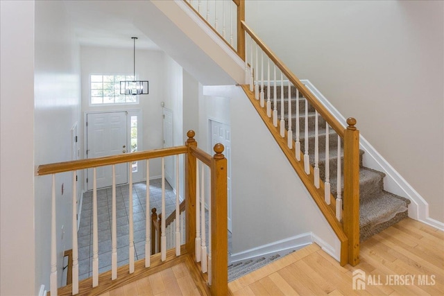 3 Rozalyn Ln, Old Bridge, NJ 08879 - staircase featuring wood finished floors and a chandelier
