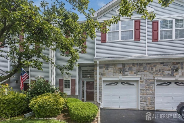 3 Rozalyn Ln, Old Bridge, NJ 08879 - multi unit property featuring a garage, stone siding, and driveway