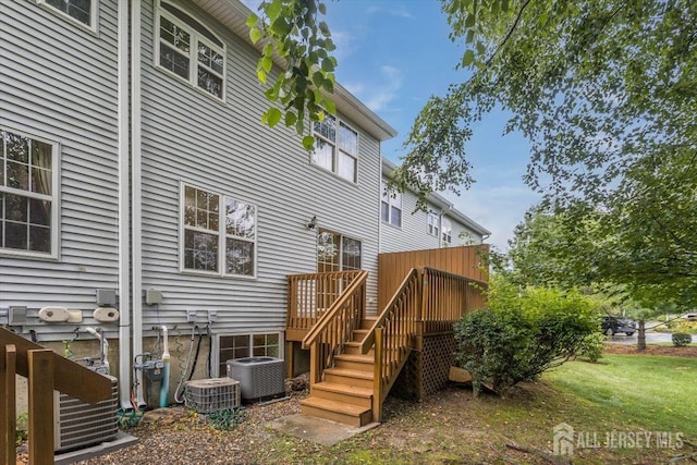 3 Rozalyn Ln, Old Bridge, NJ 08879 - back of property featuring a wooden deck, a yard, and stairs
