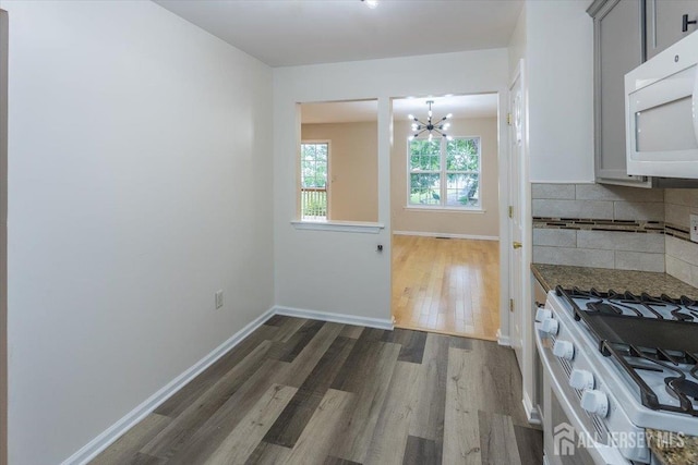3 Rozalyn Ln, Old Bridge, NJ 08879 - kitchen with white appliances, a chandelier, dark wood finished floors, backsplash, and gray cabinetry