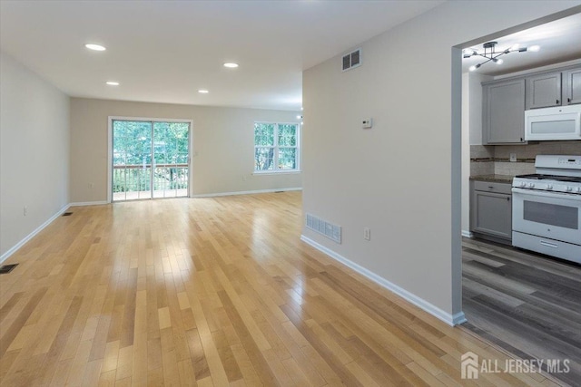 3 Rozalyn Ln, Old Bridge, NJ 08879 - kitchen with white appliances, light wood-style flooring, open floor plan, gray cabinets, and recessed lighting