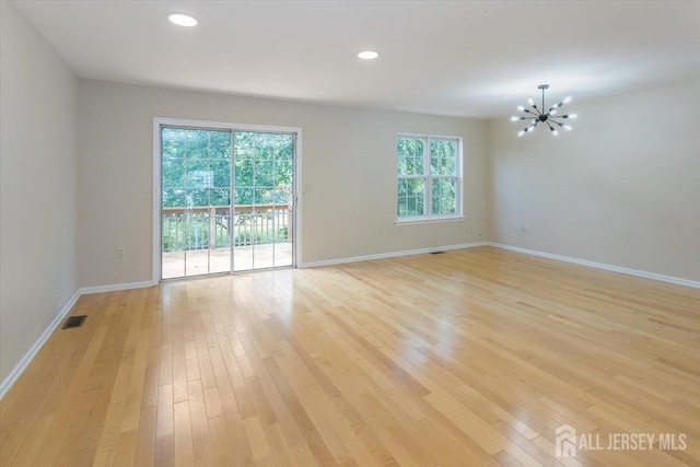 3 Rozalyn Ln, Old Bridge, NJ 08879 - empty room featuring light wood-style flooring, a chandelier, and recessed lighting
