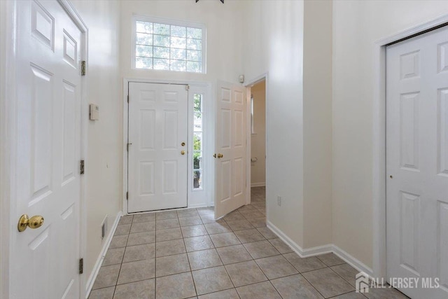 3 Rozalyn Ln, Old Bridge, NJ 08879 - foyer entrance with light tile patterned flooring, healthy amount of natural light, and a high ceiling