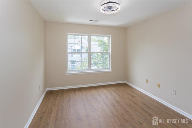 3 Rozalyn Ln, Old Bridge, NJ 08879 - spare room with wood finished floors and baseboards