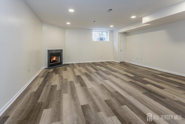 3 Rozalyn Ln, Old Bridge, NJ 08879 - below grade area featuring wood finished floors, recessed lighting, and a fireplace