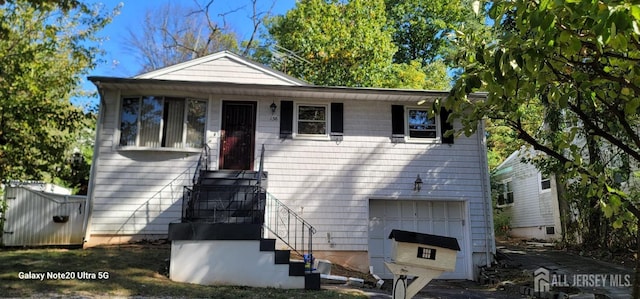 bungalow-style house featuring a garage