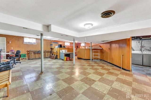77 Manhattan Ave, Avenel, NJ 07001 - basement featuring tile patterned floors, wooden walls, and washing machine and clothes dryer