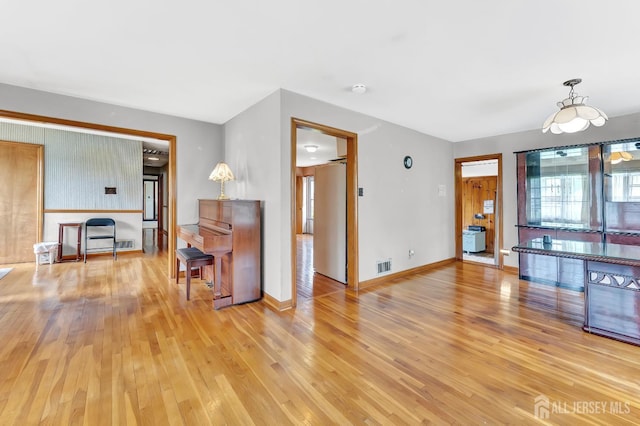 77 Manhattan Ave, Avenel, NJ 07001 - living area featuring light wood-type flooring and baseboards