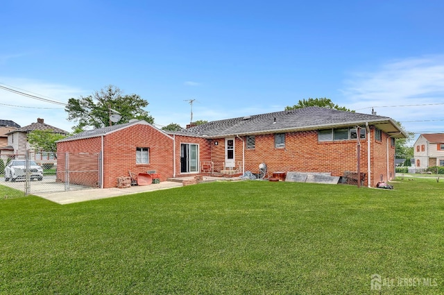 77 Manhattan Ave, Avenel, NJ 07001 - back of house with brick siding and a patio