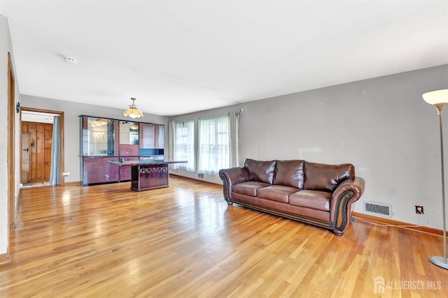 77 Manhattan Ave, Avenel, NJ 07001 - living area with light wood-style floors