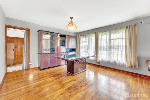 77 Manhattan Ave, Avenel, NJ 07001 - kitchen featuring light wood-style flooring, dark countertops, and pendant lighting