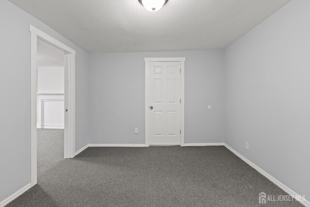 empty room with carpet flooring