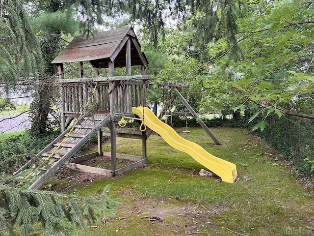 view of play area featuring a lawn