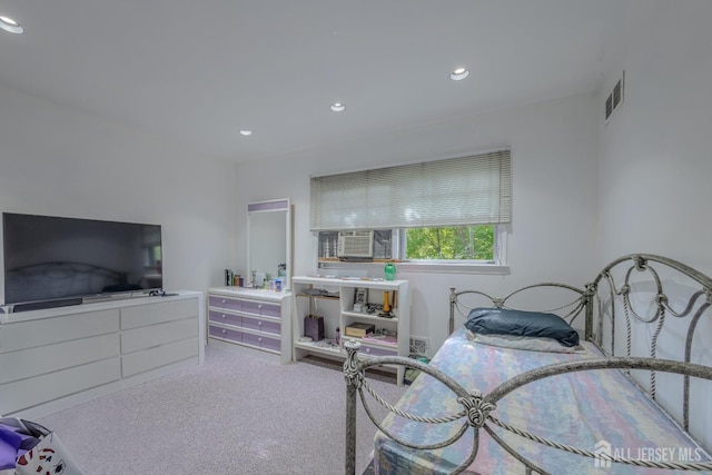 carpeted bedroom with cooling unit and recessed lighting