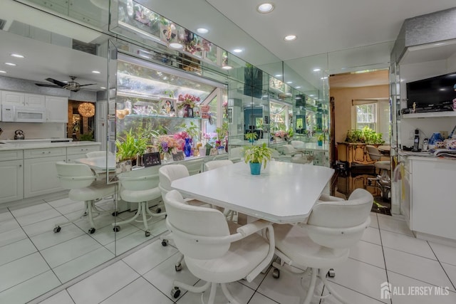 dining area featuring light tile patterned flooring, recessed lighting, and ceiling fan