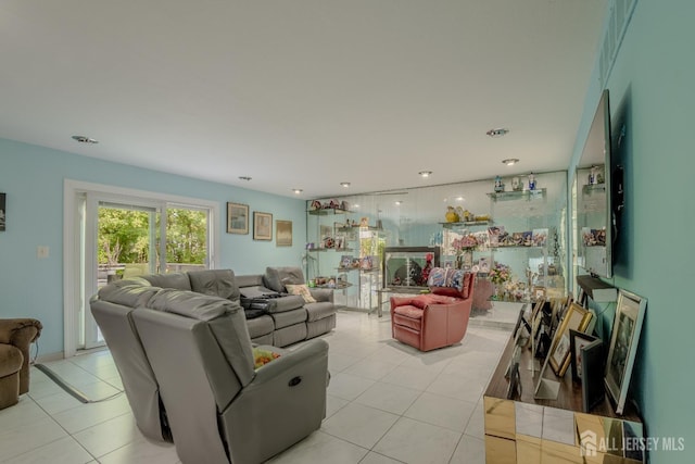 living area featuring light tile patterned floors and recessed lighting