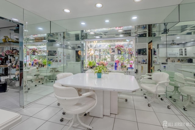 dining space featuring recessed lighting and light tile patterned floors