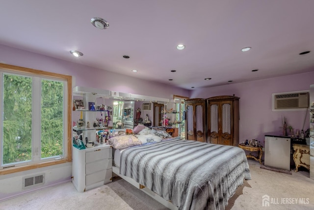 bedroom featuring carpet, fridge, multiple windows, and recessed lighting