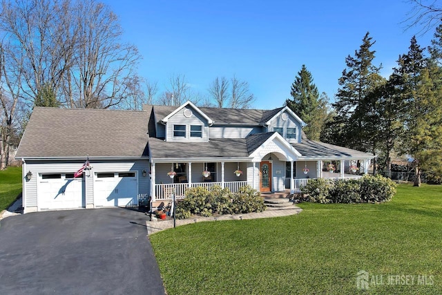 view of front of home featuring a shingled roof, a front lawn, covered porch, a garage, and driveway