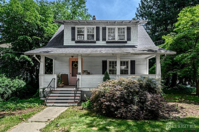 570 Main St, Metuchen, NJ 08840 - bungalow-style home featuring covered porch and a chimney