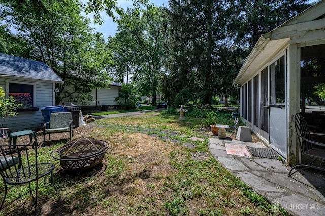 570 Main St, Metuchen, NJ 08840 - view of yard with a fire pit and a sunroom