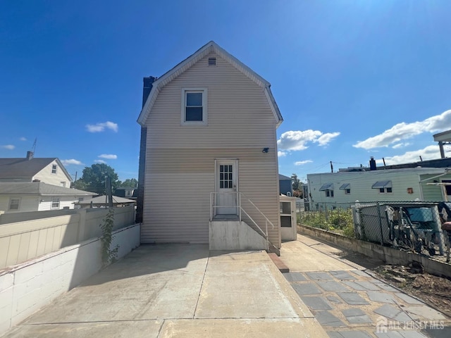 865 Kreil St, Perth Amboy, NJ 08861 - back of house with fence, a chimney, and a patio area