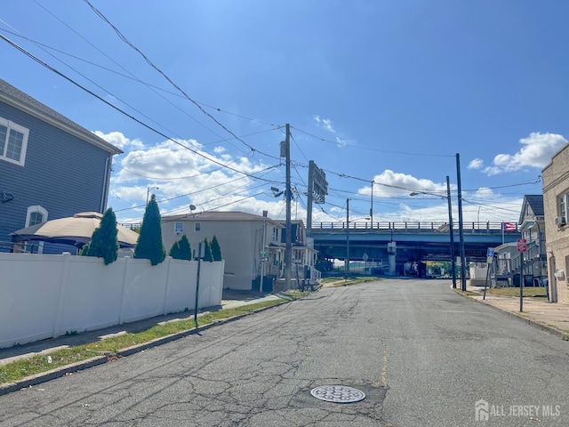 865 Kreil St, Perth Amboy, NJ 08861 - view of asphalt road featuring curbs and traffic signs