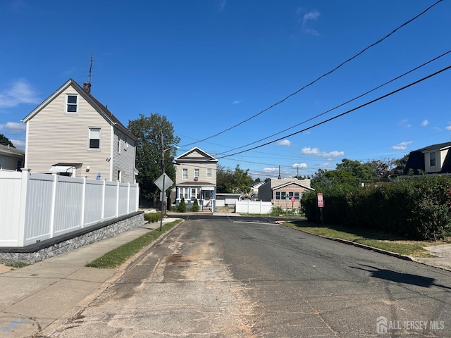865 Kreil St, Perth Amboy, NJ 08861 - view of asphalt street featuring traffic signs and curbs