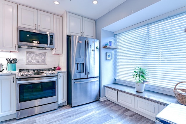 16 Jeanette Ct Unit 293, Jamesburg, NJ 08831 - kitchen with stainless steel appliances, white cabinets, backsplash, light countertops, and recessed lighting