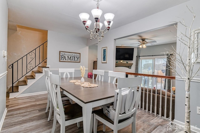 16 Jeanette Ct Unit 293, Jamesburg, NJ 08831 - dining space featuring wood finished floors, a chandelier, stairs, and a ceiling fan