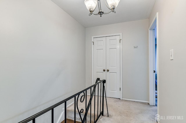 16 Jeanette Ct Unit 293, Jamesburg, NJ 08831 - hall featuring light colored carpet, a chandelier, and an upstairs landing