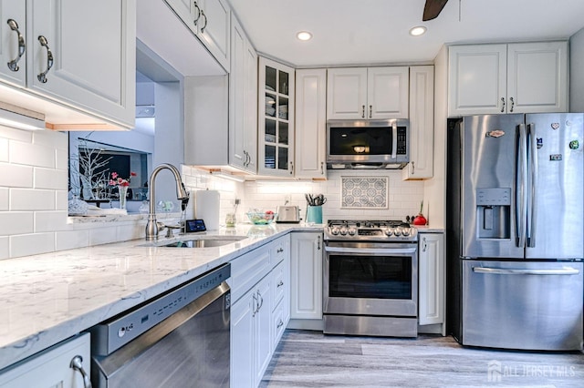 16 Jeanette Ct Unit 293, Jamesburg, NJ 08831 - kitchen with stainless steel appliances, backsplash, light stone countertops, glass insert cabinets, and recessed lighting
