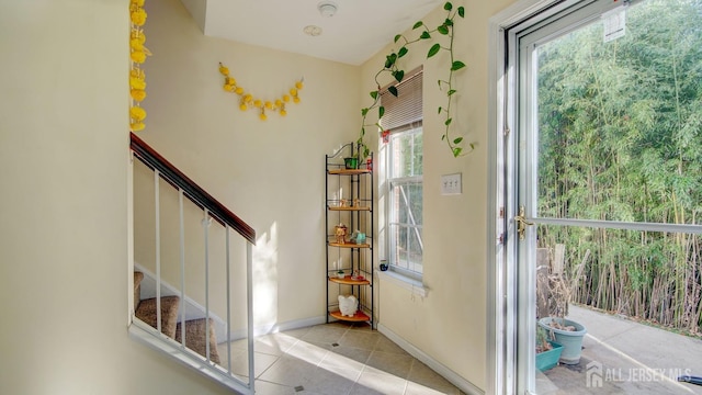 entryway featuring light tile patterned floors