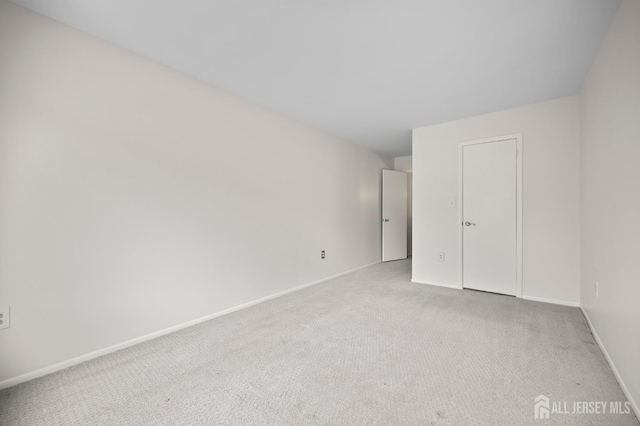 70 Lexington Cir, Old Bridge, NJ 07747 - unfurnished bedroom featuring carpet floors and baseboards