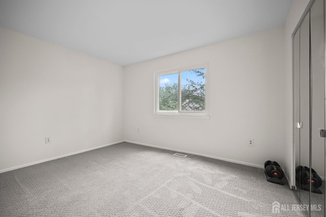 70 Lexington Cir, Old Bridge, NJ 07747 - unfurnished bedroom with carpet floors and a closet