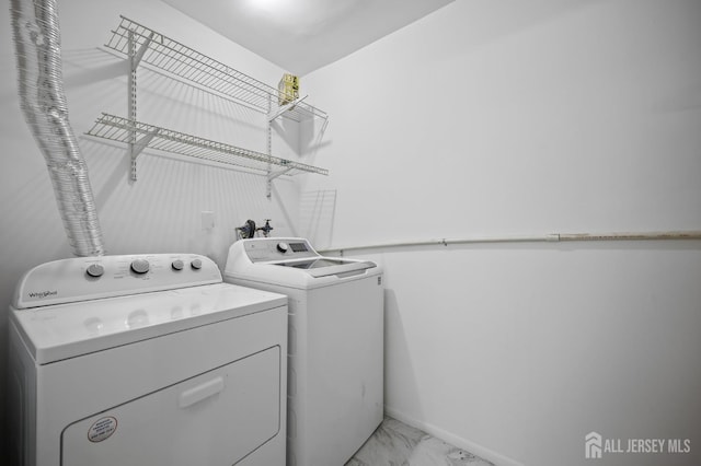 70 Lexington Cir, Old Bridge, NJ 07747 - laundry area featuring washer and dryer and light marble finish floors