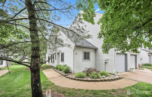 70 Lexington Cir, Old Bridge, NJ 07747 - view of property exterior with a shingled roof, a yard, and driveway