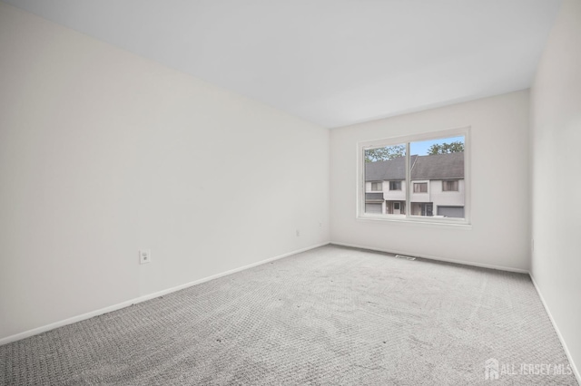70 Lexington Cir, Old Bridge, NJ 07747 - empty room with baseboards and carpet floors