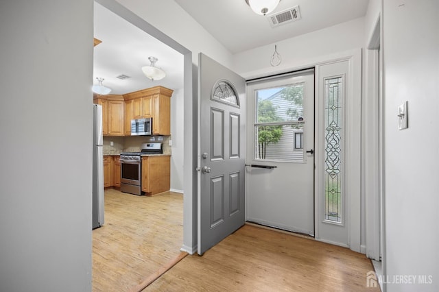 70 Lexington Cir, Old Bridge, NJ 07747 - entrance foyer featuring light wood-style floors