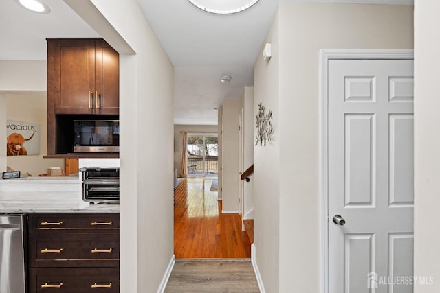 hall with light wood-type flooring