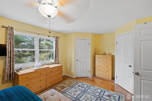 bedroom featuring ceiling fan and light hardwood / wood-style floors