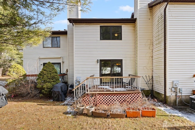 3 Wood Acres Dr, North Brunswick, NJ 08902 - back of property featuring a chimney and a wooden deck