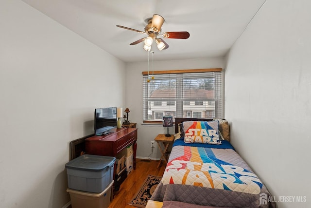 bedroom featuring dark hardwood / wood-style floors and ceiling fan