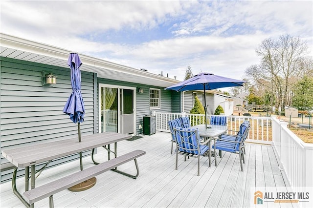 wooden deck with outdoor dining area