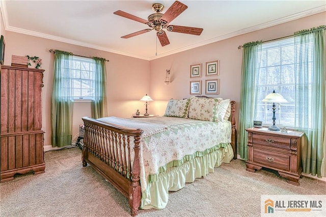 bedroom featuring crown molding and carpet