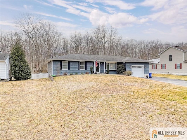 single story home featuring a front yard, fence, a garage, and driveway