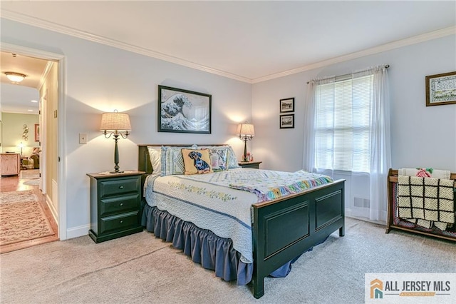 bedroom featuring visible vents, baseboards, light colored carpet, and ornamental molding