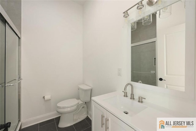 full bath featuring tile patterned flooring, a shower with shower door, vanity, and toilet