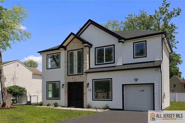 12 Idlewild Rd, Edison, NJ 08817 - view of front of home with a garage and stone siding