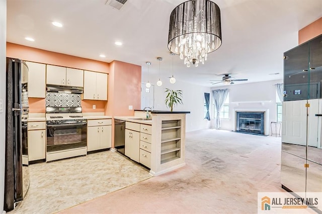 331 Cozzens Ct Unit 331, East Brunswick, NJ 08816 - kitchen with gas range oven, under cabinet range hood, ceiling fan, light carpet, and pendant lighting